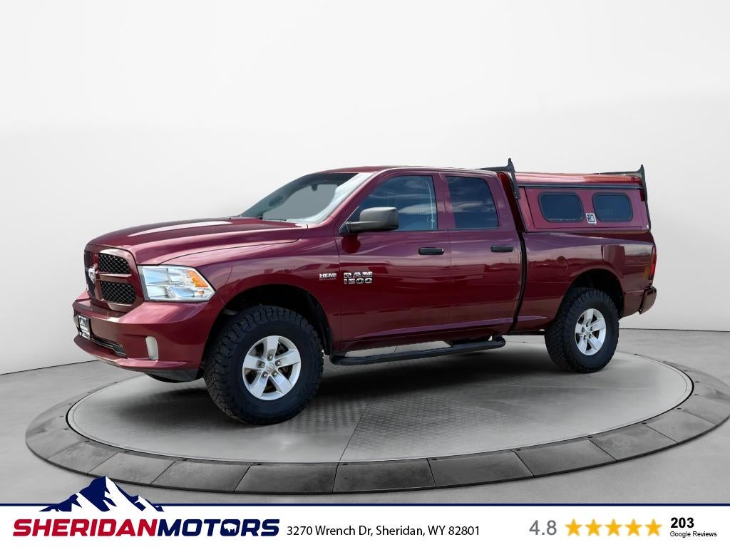 2017 RAM 1500 Express Quad Cab 4x4 6'4' Box in Delmonico Red Pearlcoat — front three-quarter view