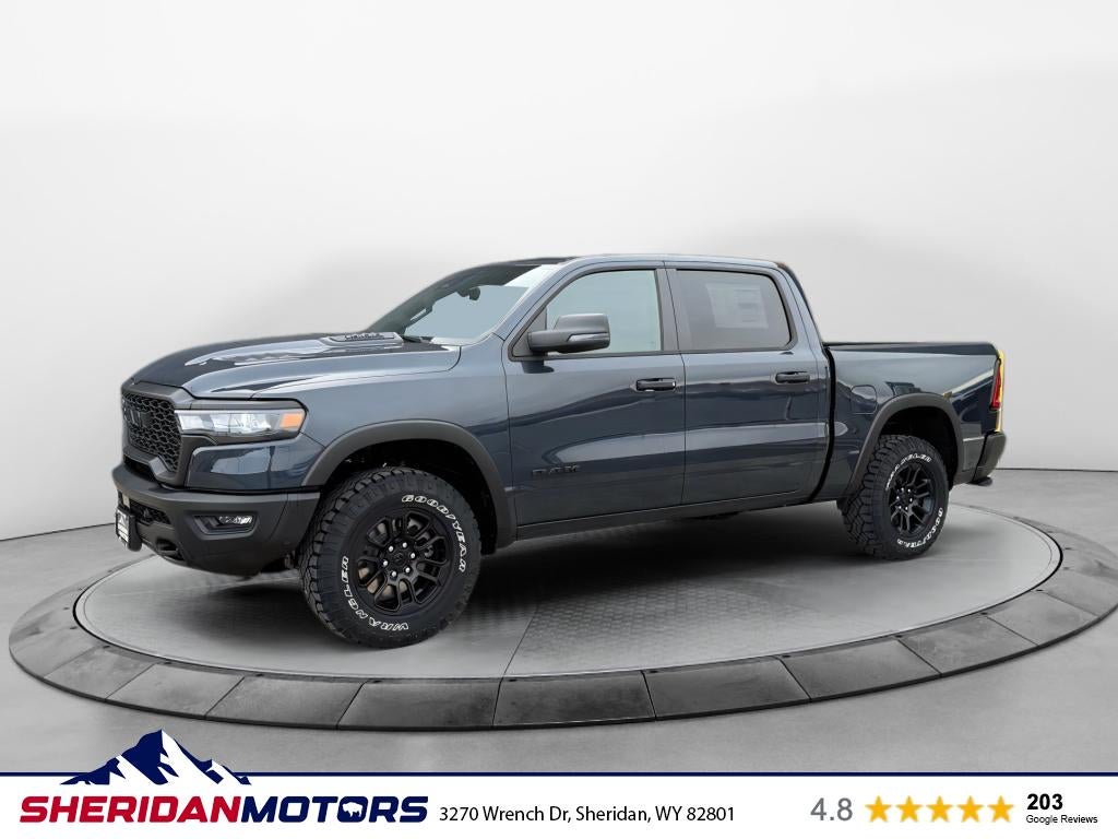 2026 RAM Ram 1500 RAM 1500 REBEL CREW CAB 4X4 5'7' BOX in Forged Blue Metallic Exterior Paint — front three-quarter view