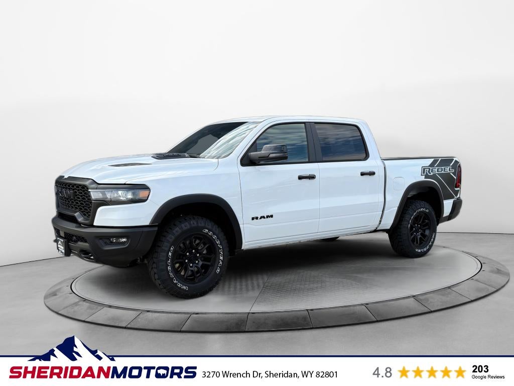 2026 RAM Ram 1500 RAM 1500 REBEL CREW CAB 4X4 5'7' BOX in Bright White Clear-Coat Exterior Paint — front three-quarter view