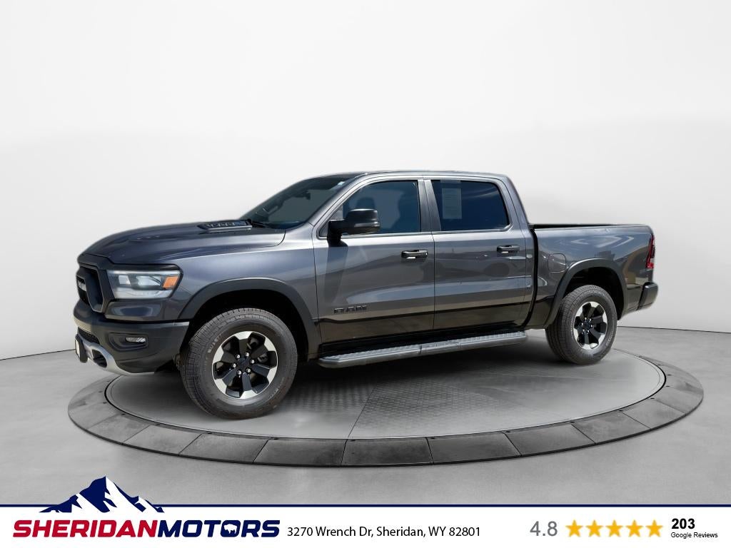 2024 RAM 1500 Rebel Crew Cab 4x4 5'7' Box in Granite Crystal Metallic Clearcoat — front three-quarter view