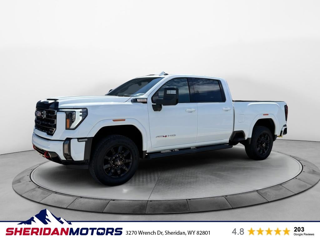 2024 GMC Sierra 2500HD AT4 in Summit White — front three-quarter view